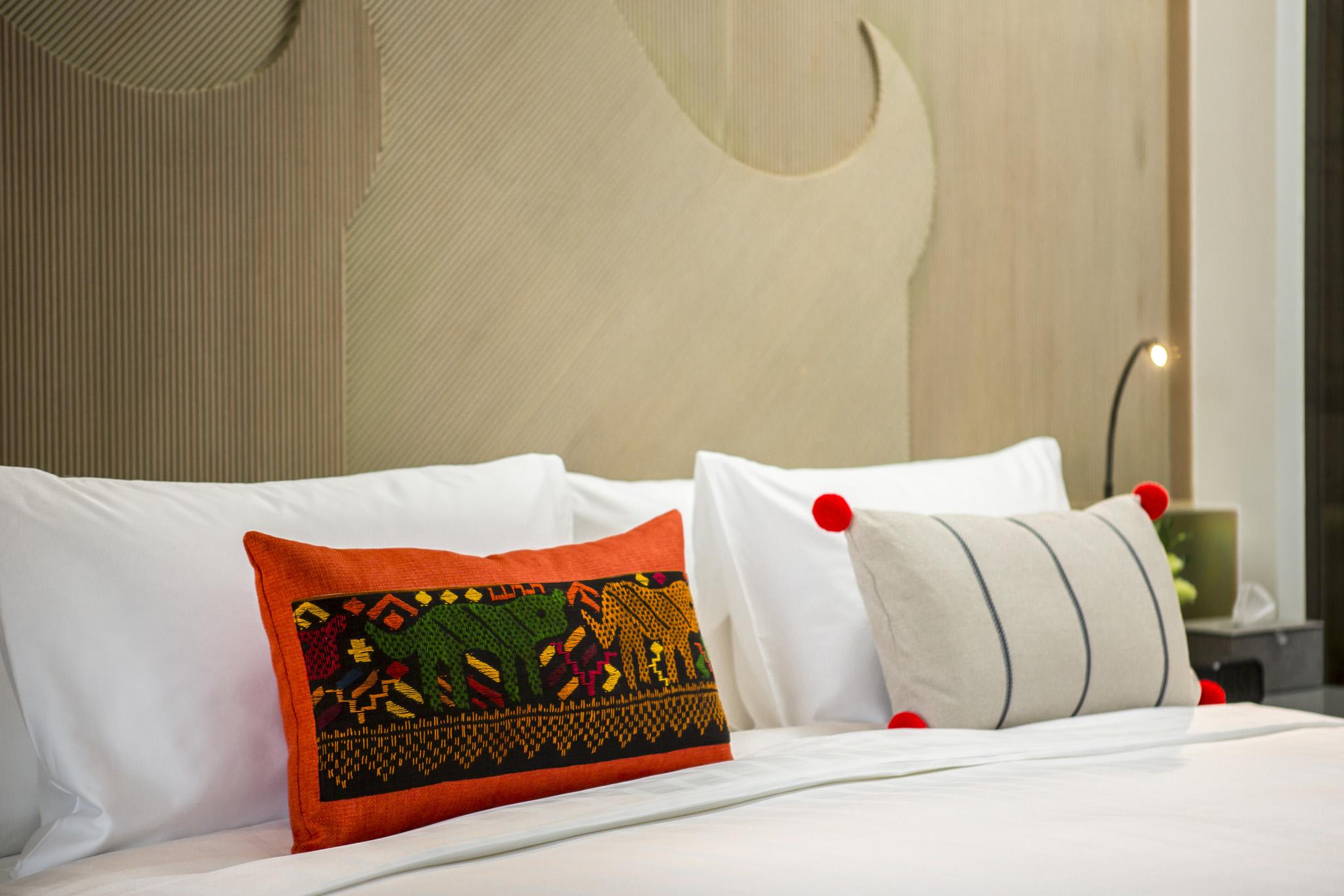 清邁u尼姆曼酒店 外观 照片 A bed with cushions